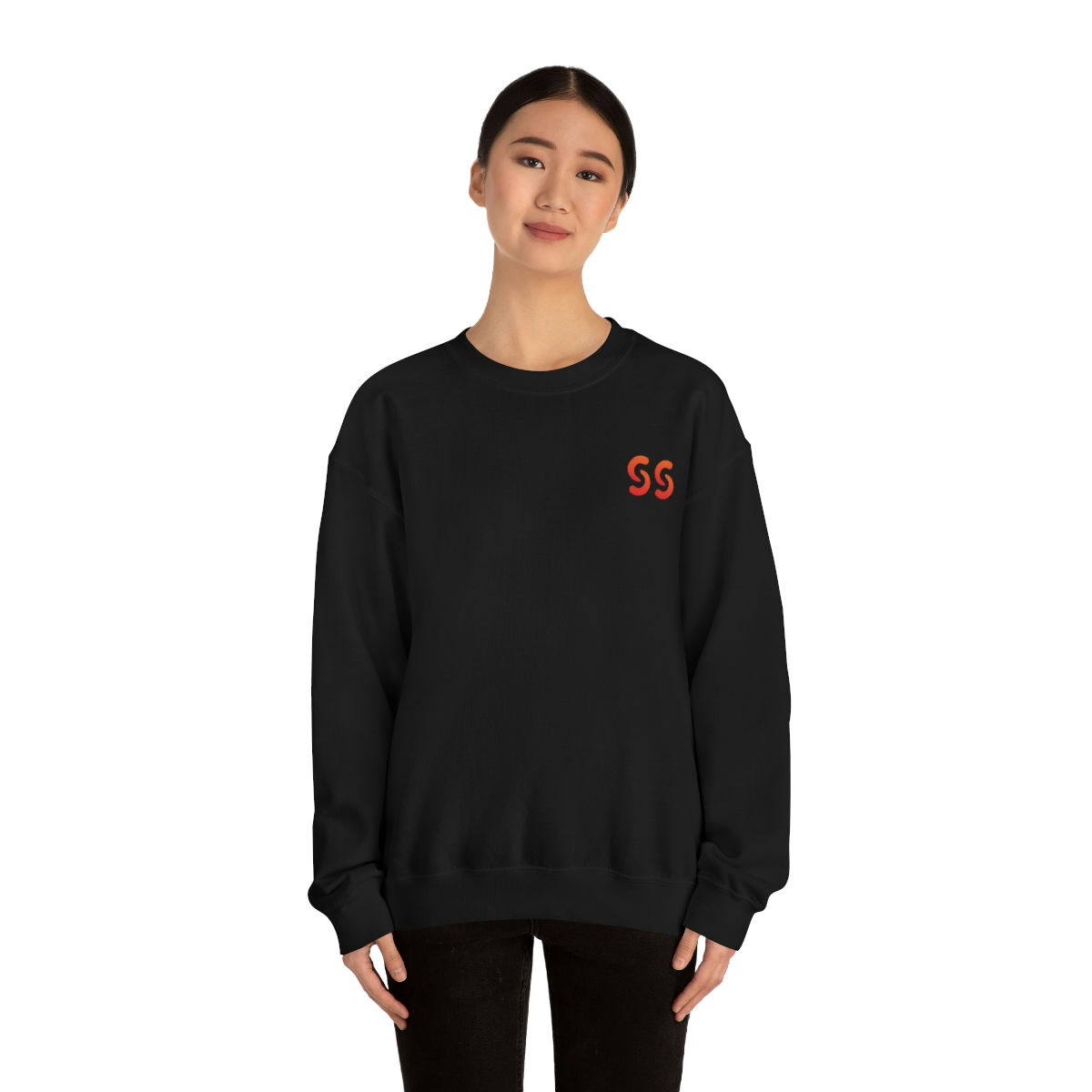 A young light skin tone female model wearing a black sweatshirt with stylized "SS" over the left breast denoting sickle cell trait status.