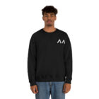 A young medium skin tone male model wearing a black sweatshirt with stylized "AA" over the left breast denoting sickle cell trait status.