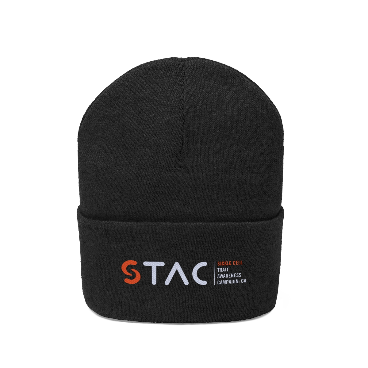 Front view of dark ash colored beanie-style knit hat with the STAC logo embroidered on the folded area.